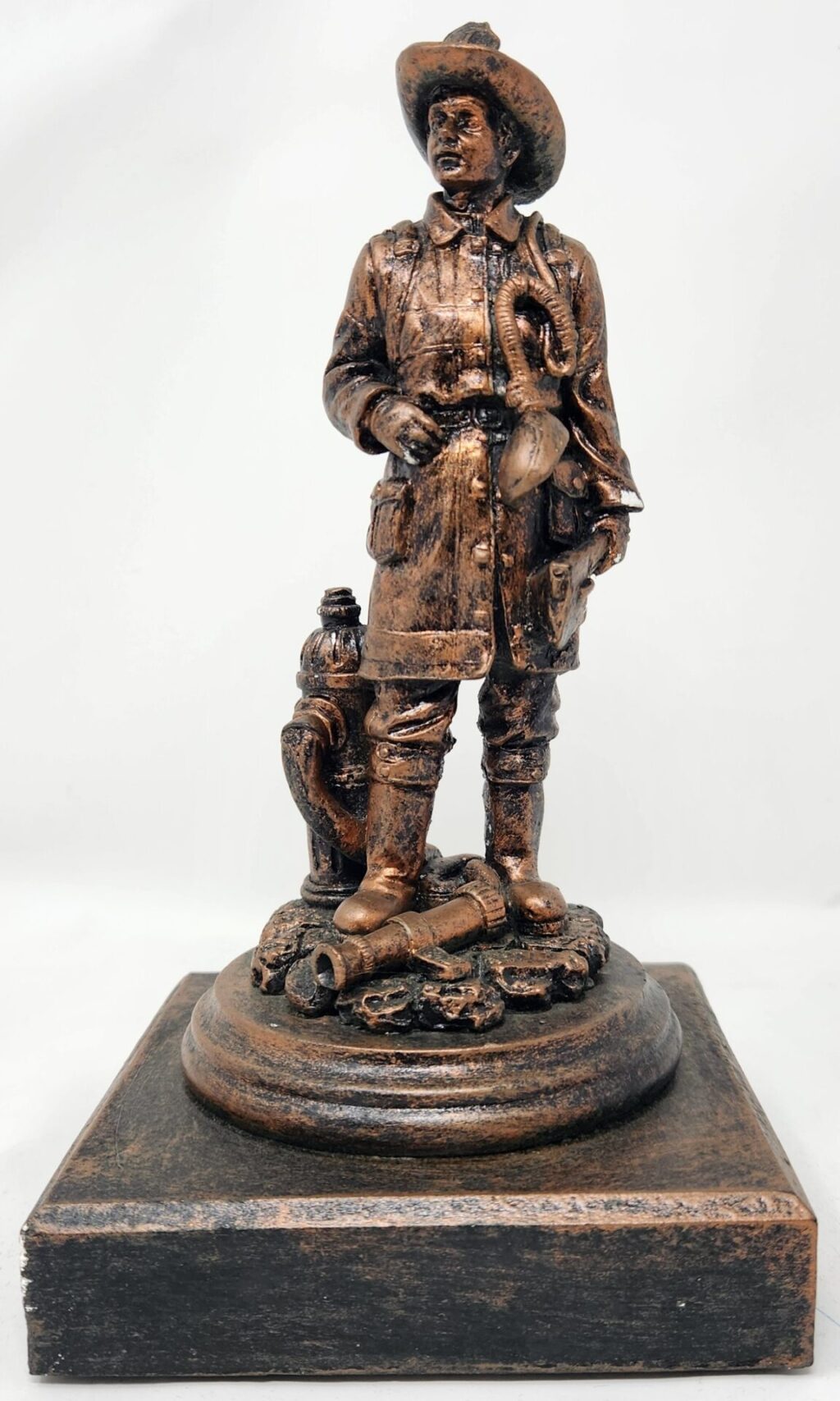 Dry Brush Bronze Fireman with Hydrant.