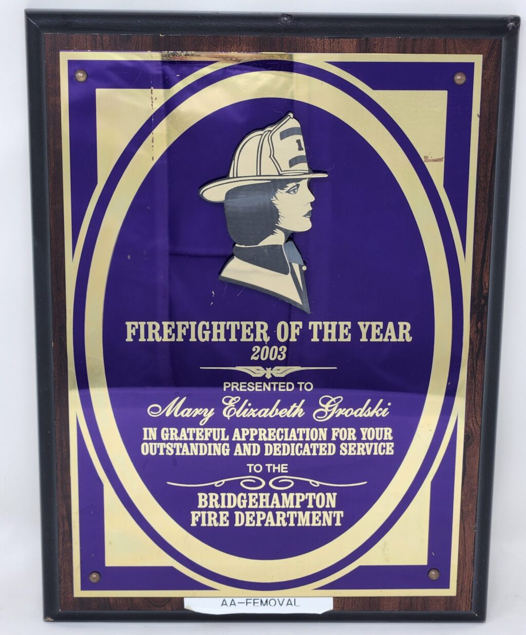 EMOVAL - Raised Gold Flat Relief of a Female Firefighter.